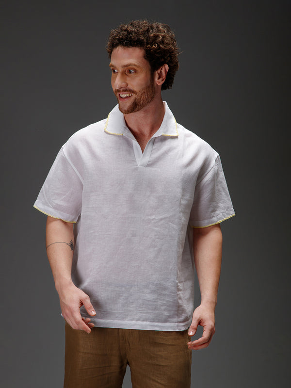 White polo shirt with a yellow trim 