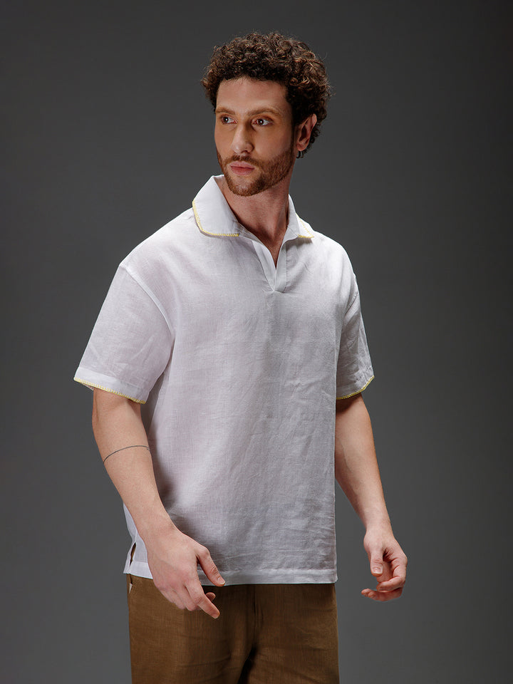 Man wearing a white polo shirt with a collar 